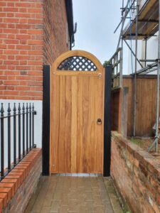 Arched gate with metal lattice