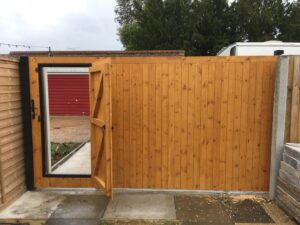 Solid sliding gate with wicket door